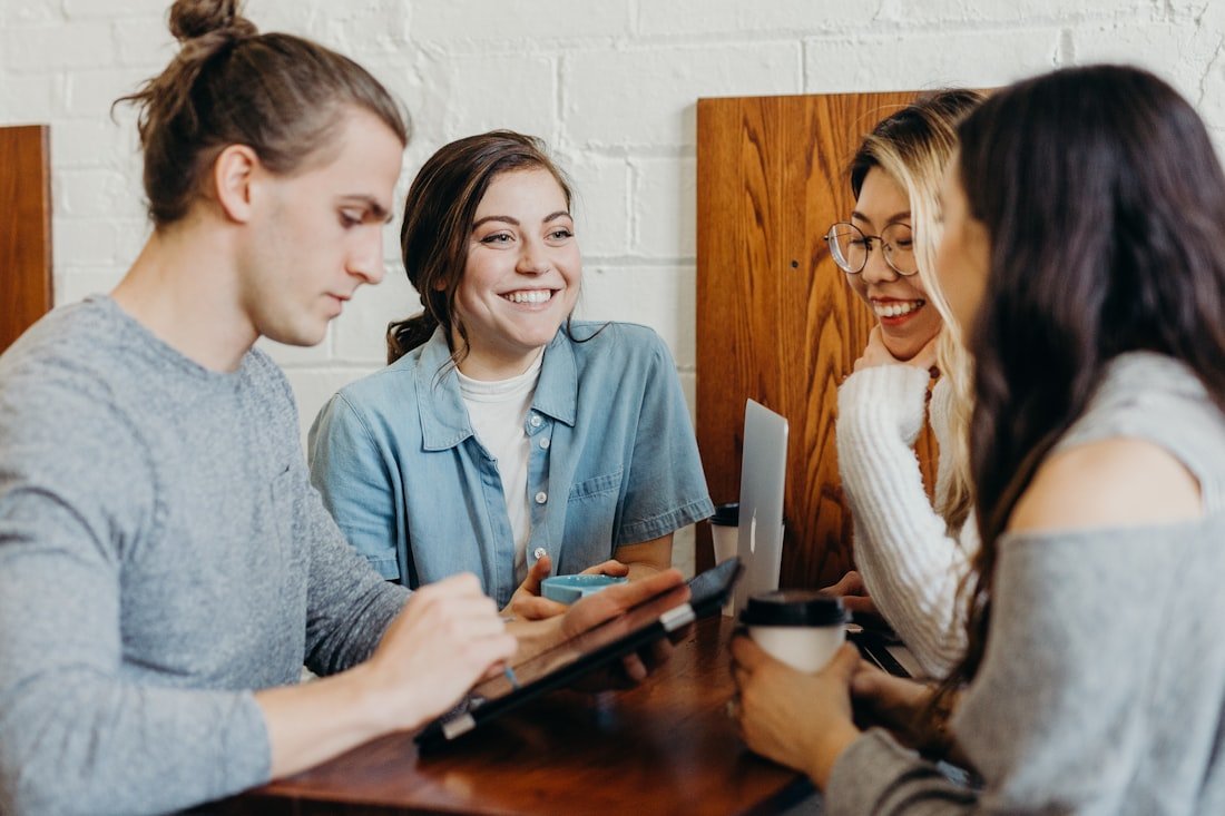Members smiling and getting to know each other over coffee
